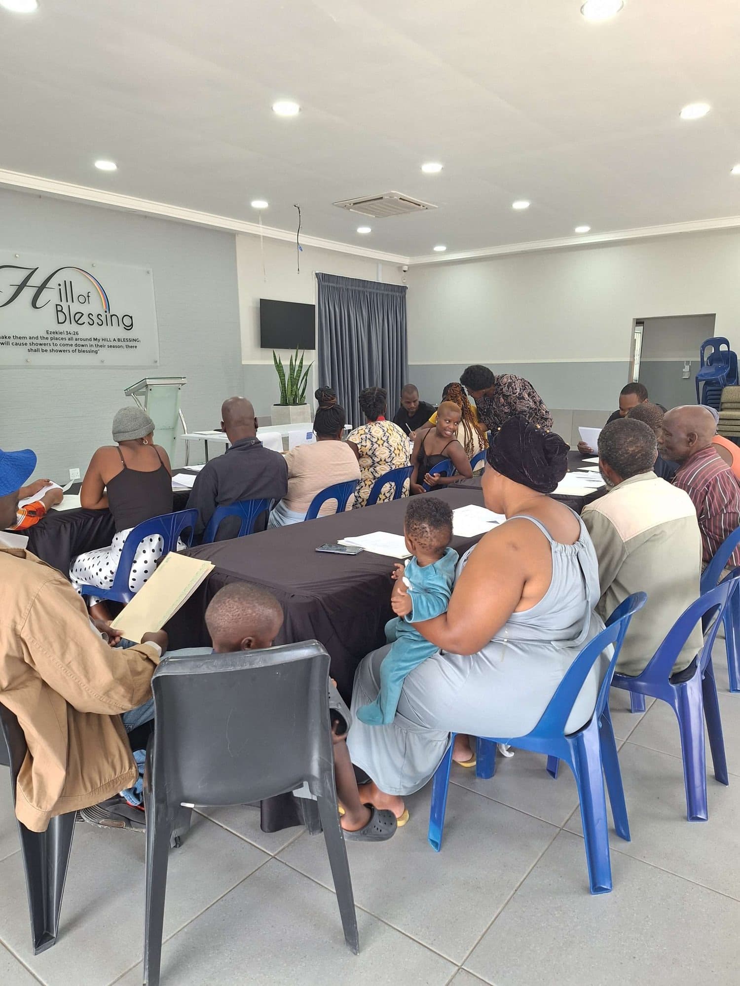 Community members gathered together at Hill of Blessing