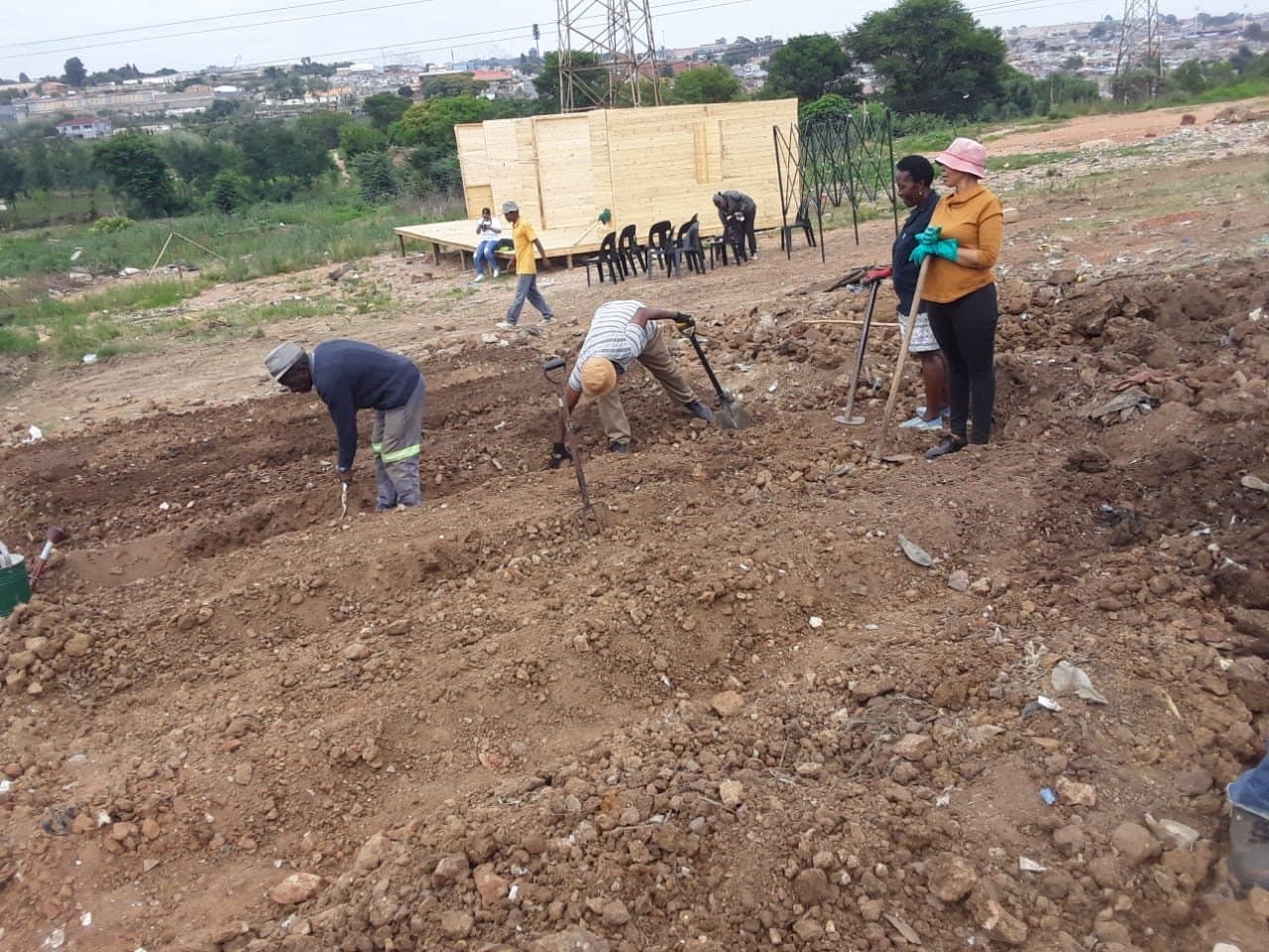 Community members breaking ground on a new development site
