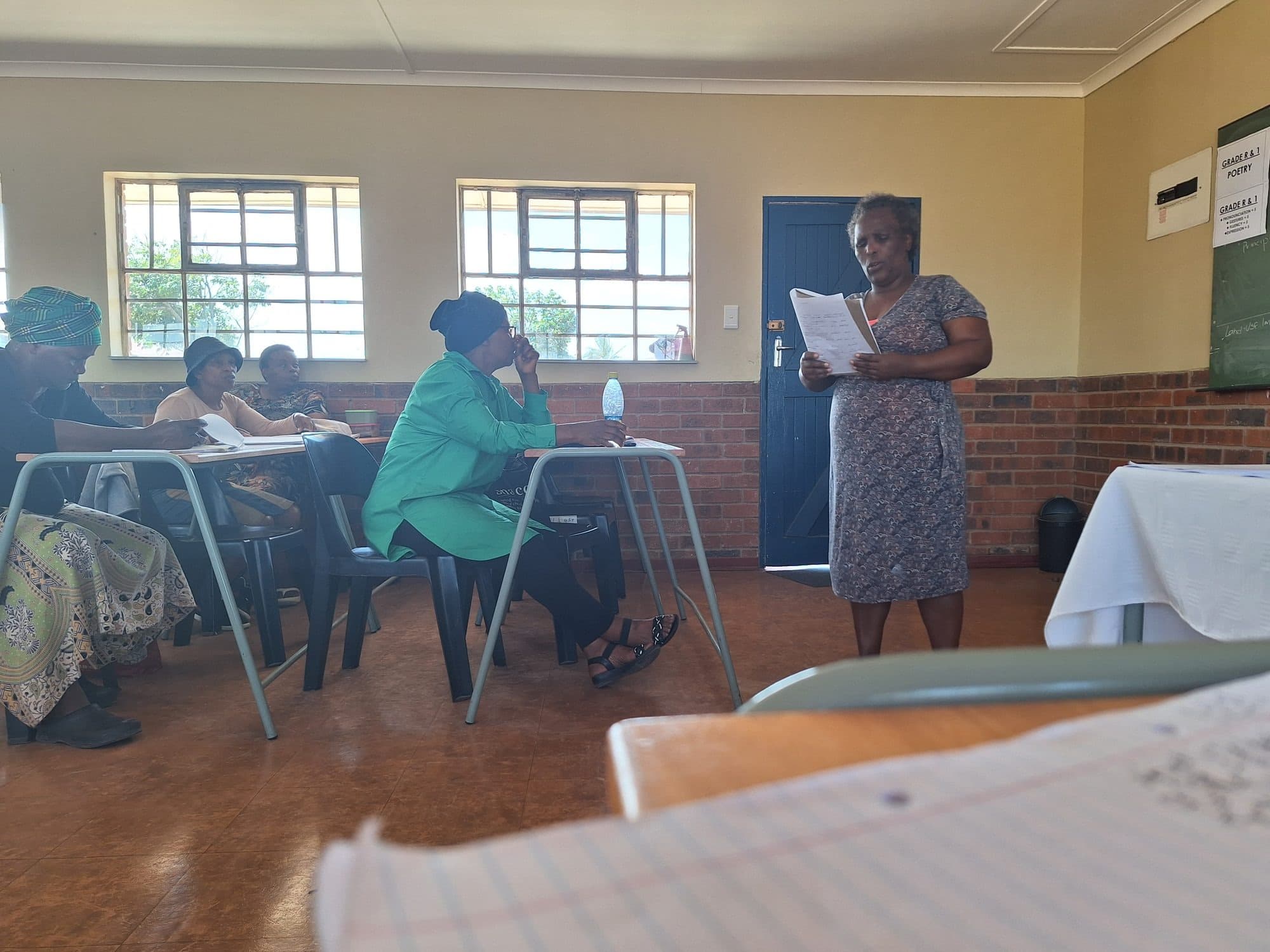 A community training and poetry session in progress