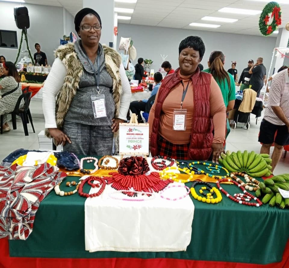 Vuka Retail stallholders selling beadwork, fabric, and produce at a market